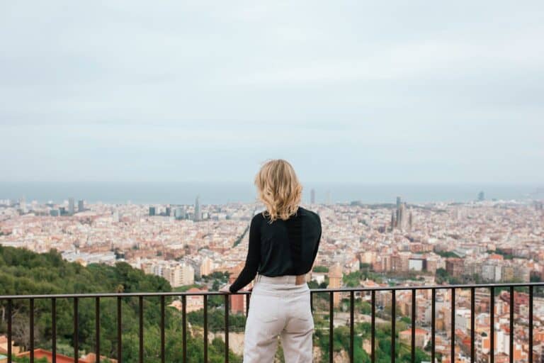 Woman looking out over Barcelona — career transition coaching Niv Nicolas Nowbakht Business Coach Berlin